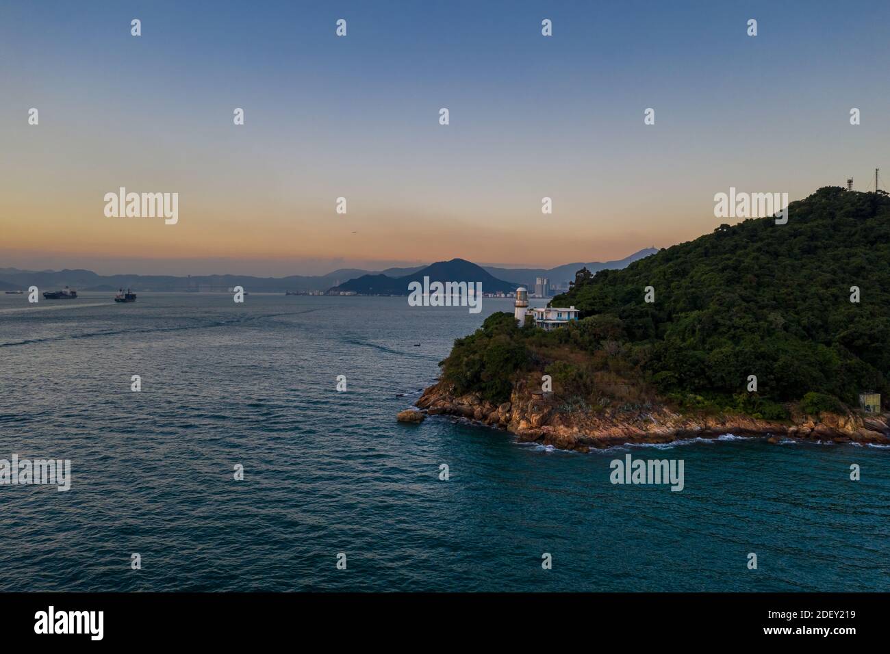 Faro di Victoria Harbour al tramonto, Green Island Foto Stock