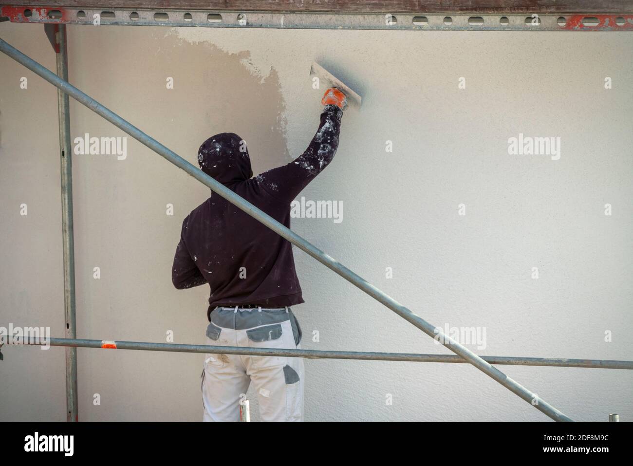 Cantiere, isolamento termico, isolamento esterno, isolamento facciata, facciata isolata di un nuovo edificio è intonacato, Duisburg, NRW, Germania Foto Stock