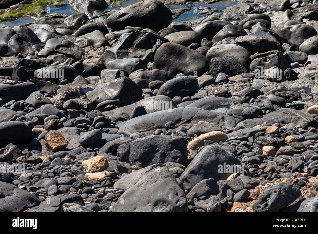 Rocce vulcaniche struttura pietra lavica liscia struttura di fondo. Foto Stock