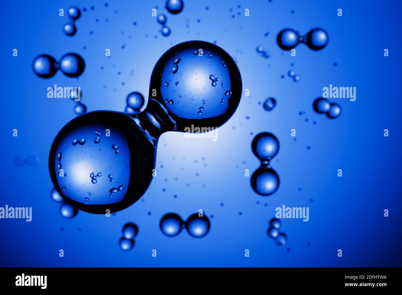 Rendering 3d: Astratte le molecole di idrogeno H2 davanti allo sfondo blu vignettato Foto Stock