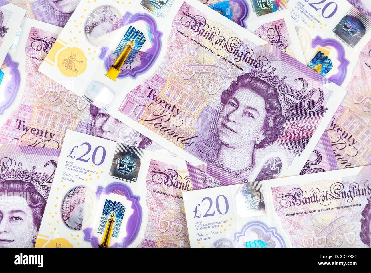 Sparse nuove note polimeriche da 20 libbre con il monarca britannico Queen Elisabetta II Foto Stock