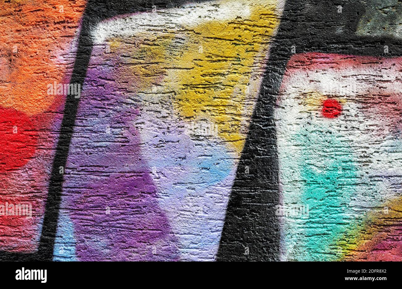 Parete dipinta multicolore. Sfondo astratto Foto Stock