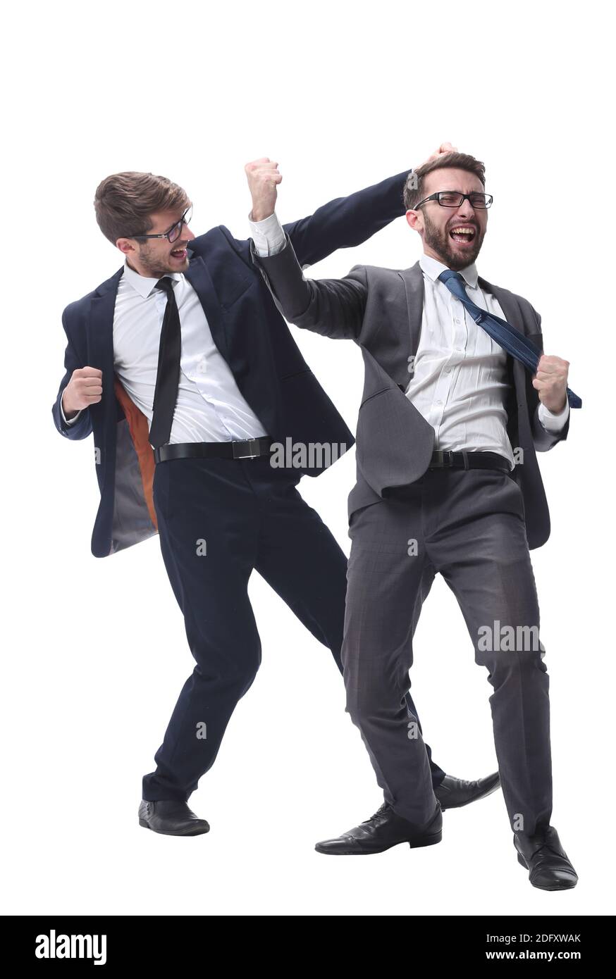 Giovane uomo d'affari cordiale seduto alla sua scrivania Foto Stock