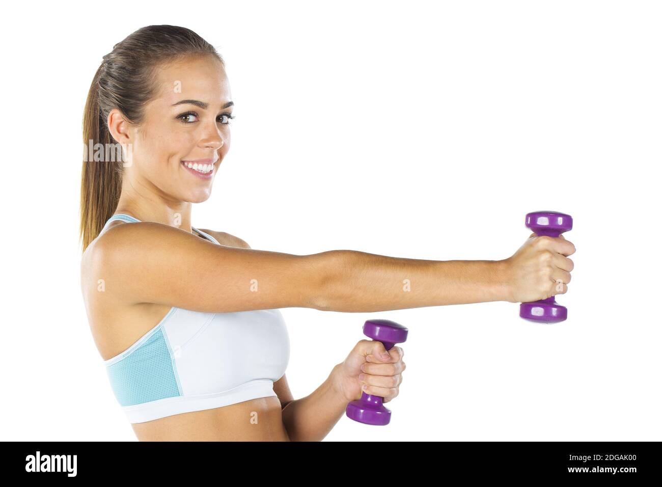 Splendido modello di Brunette Fitness che si sta allenando in un ambiente studio Foto Stock