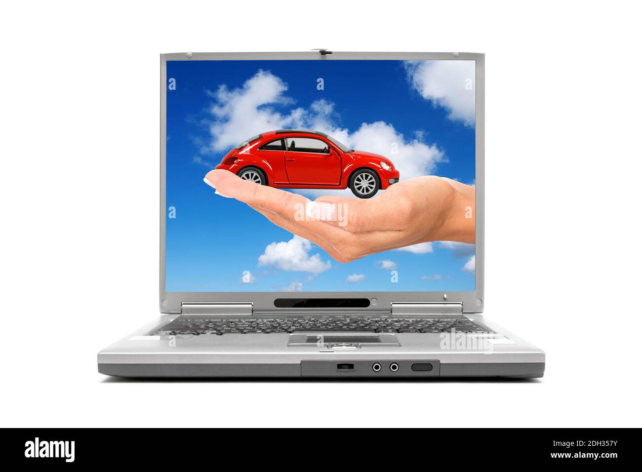 Laptop mano zeigt mit Modellauto Foto Stock
