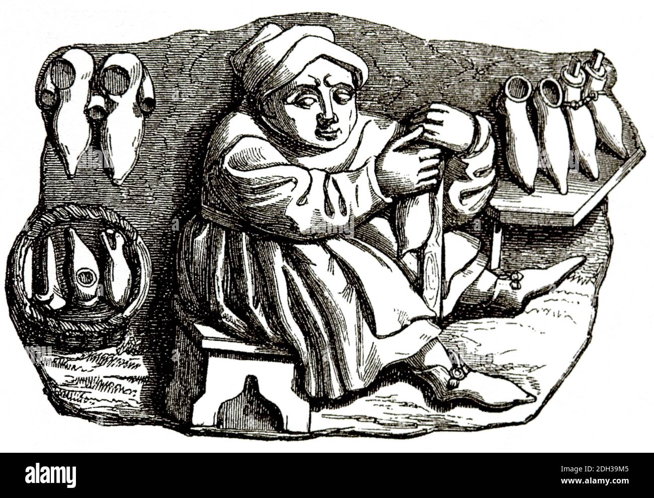 Medioevo. Europa. Un cordwainer che fa le scarpe. Incisione. Colorazione successiva. Foto Stock
