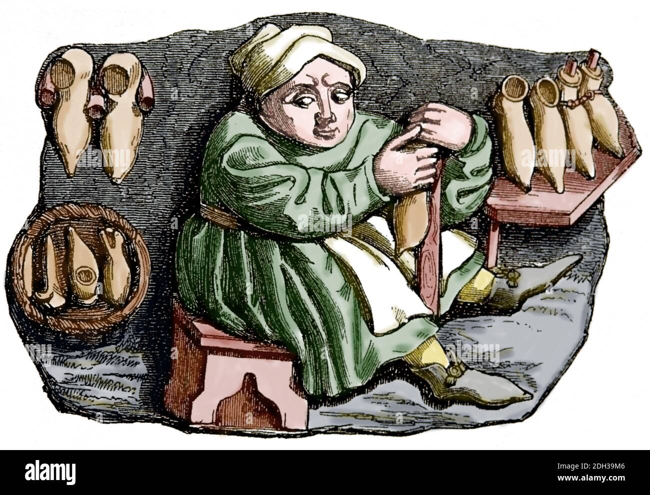 Medioevo. Europa. Un cordwainer che fa le scarpe. Incisione. Colorazione successiva. Foto Stock