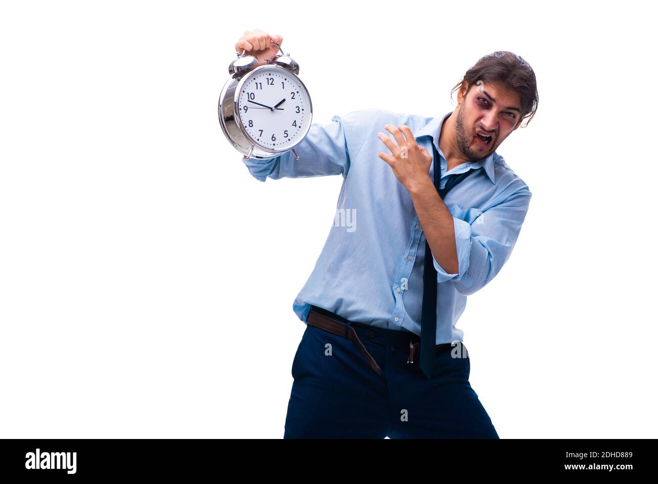 Infelice giovane impiegato di sesso maschile nel concetto di gestione del tempo Foto Stock