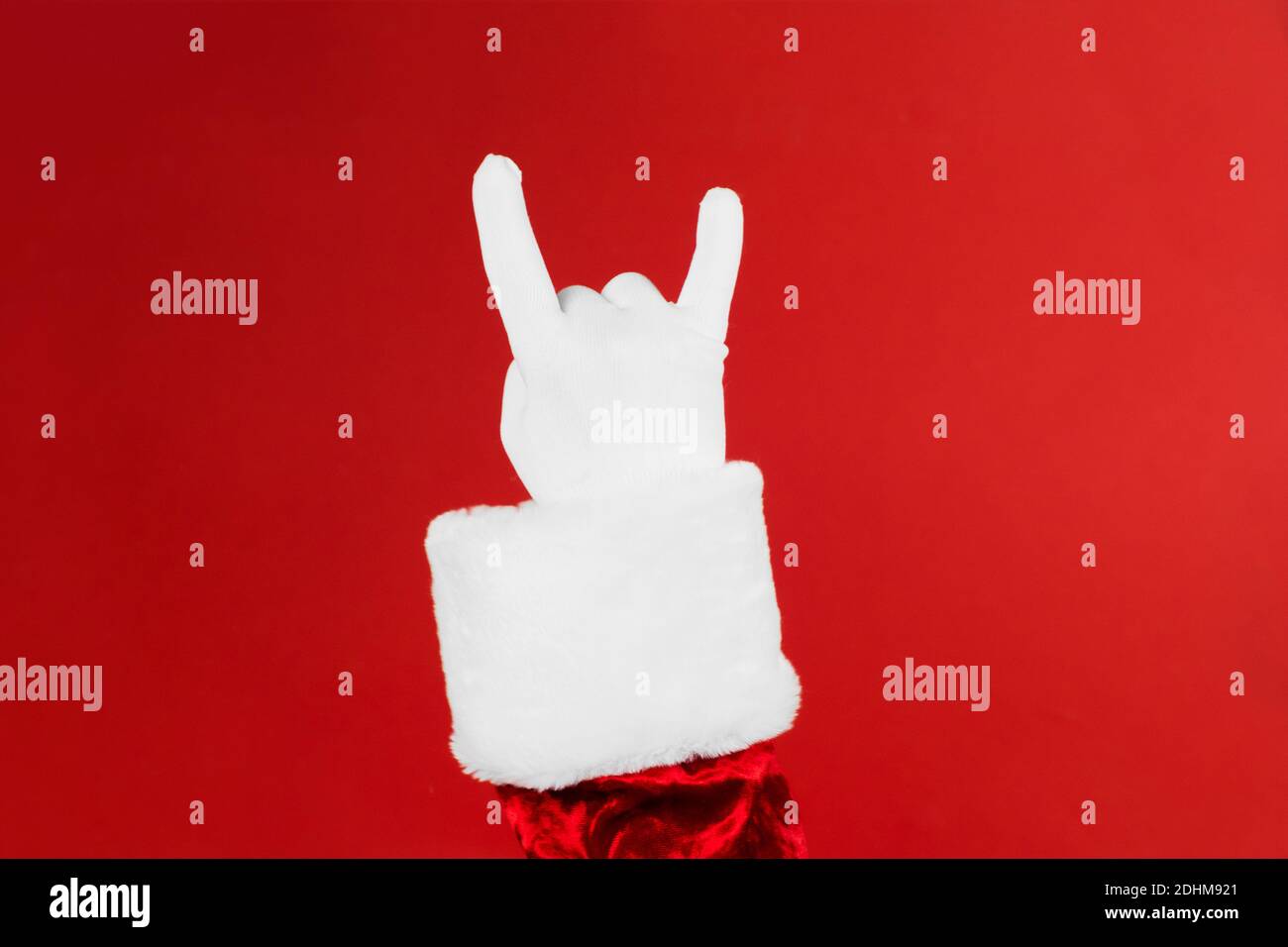 Babbo Natale mano rock n roll. Poster o biglietto d'auguri per il concerto di Christmas Rock. Foto Stock