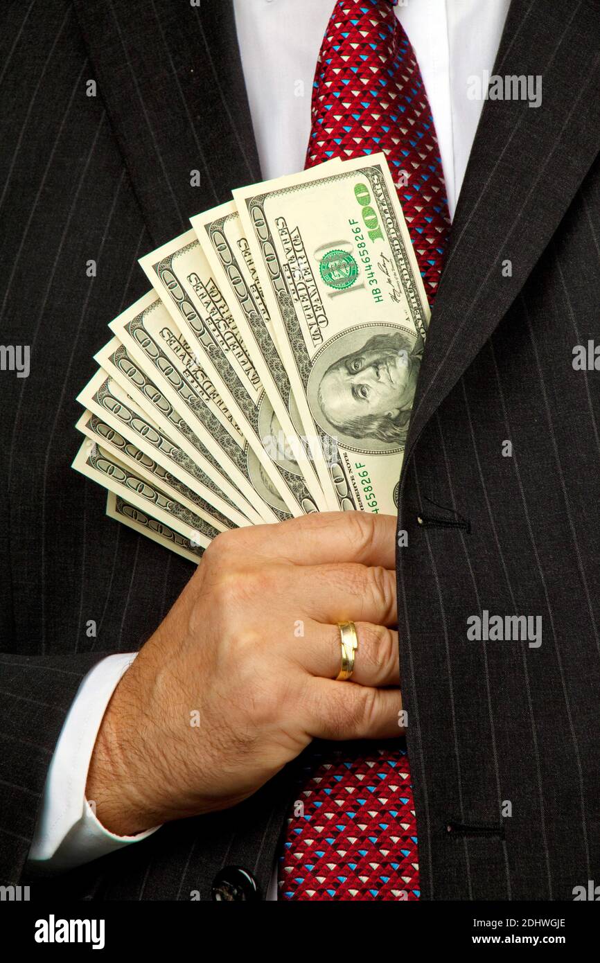 Manager mit US Dollar im Anzug Foto Stock