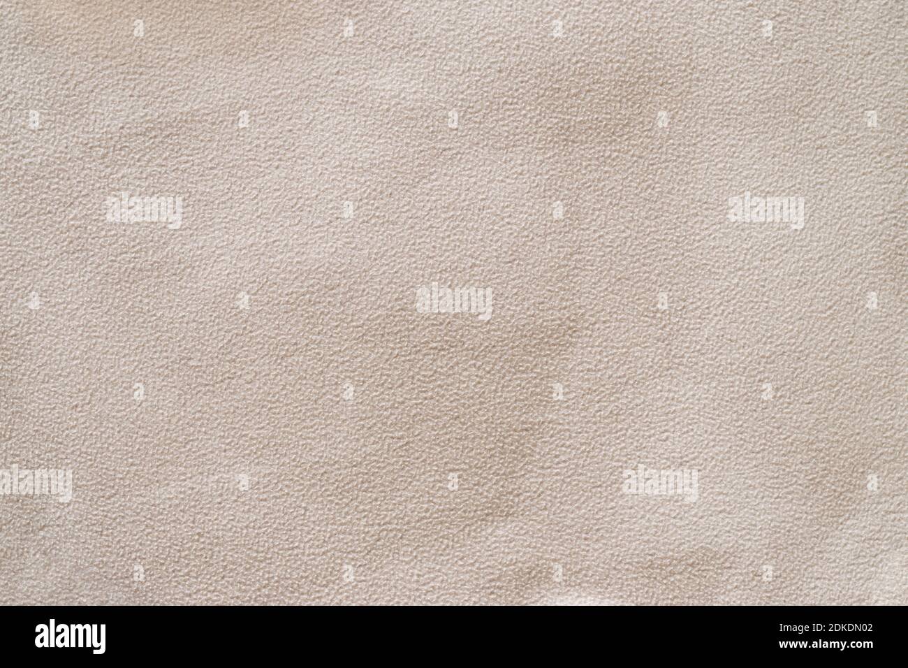 Struttura astratta di tessuto in flanella di spugna beige con pellet e grumi primo piano, sfondo Foto Stock