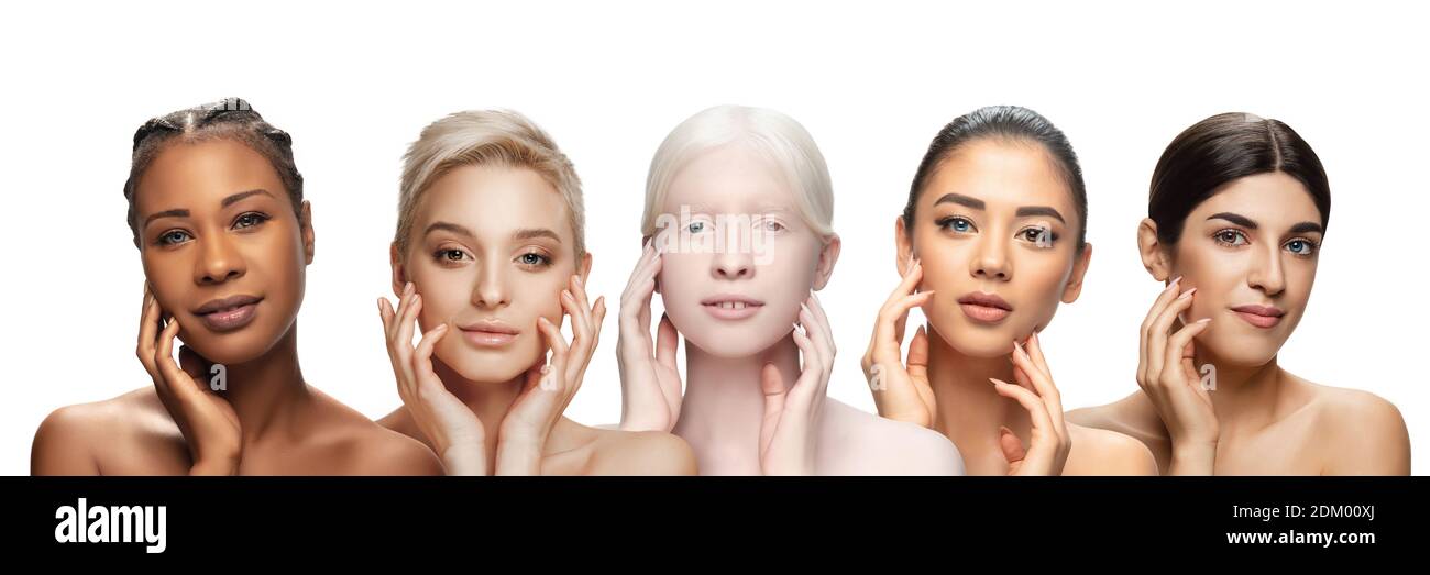 Bellezza multietnica. Diversa etnia, belle giovani donne con eterocromia su sfondo bianco. Volantino per l'annuncio. Concetto di bellezza, moda, salute, cura della pelle. Interrazziale e multiculturalismo. Foto Stock