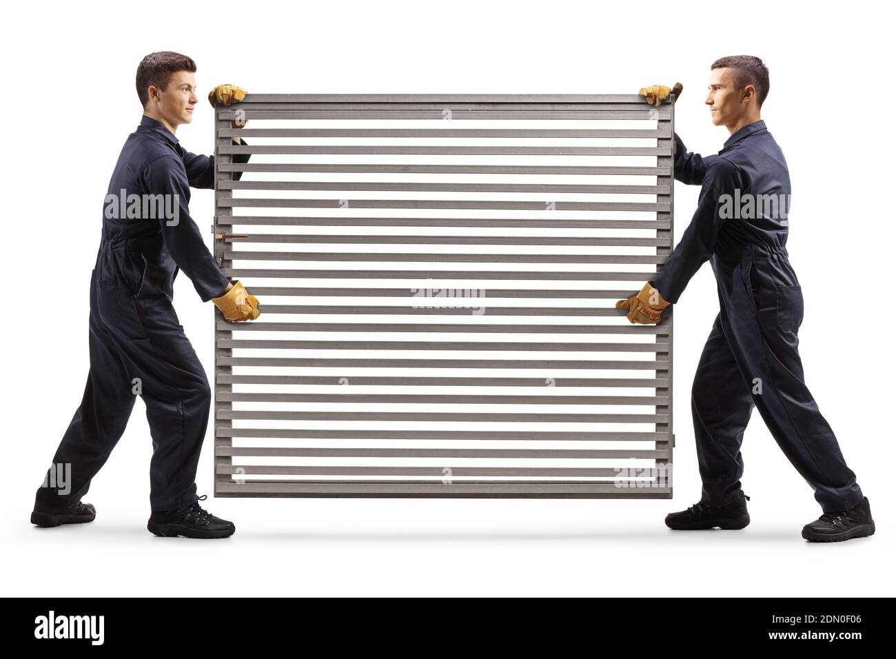 Workers carrying a silver metal grill door isolated on white background Foto Stock