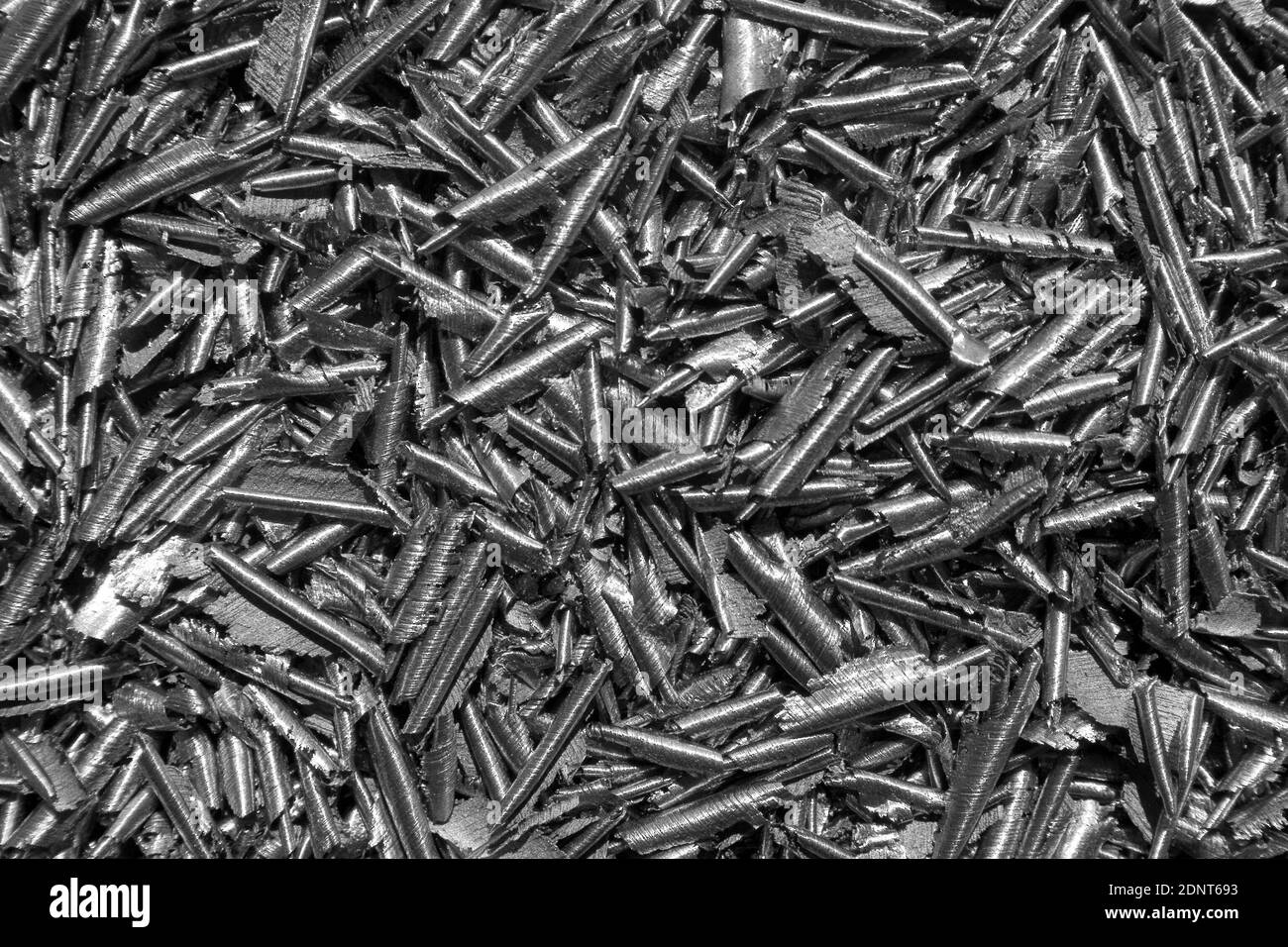 Trucioli di metallo scheggiato (uno spreco dal processo di lavorazione dei metalli) come sfondo Foto Stock