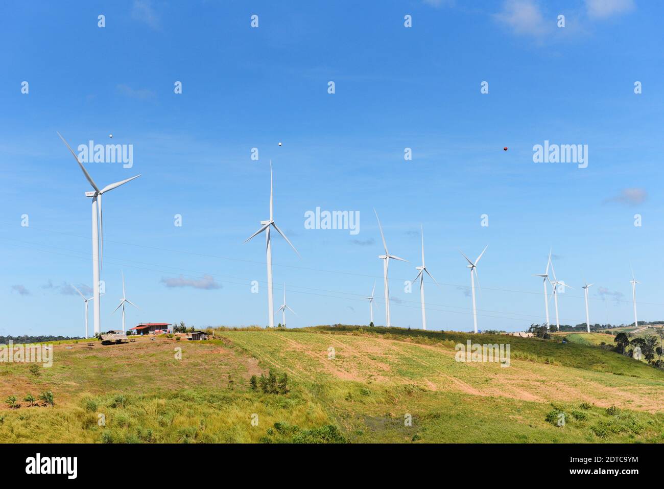wind turbine landscape natural energy green Eco power concept at wind turbines farm blue sky background Foto Stock
