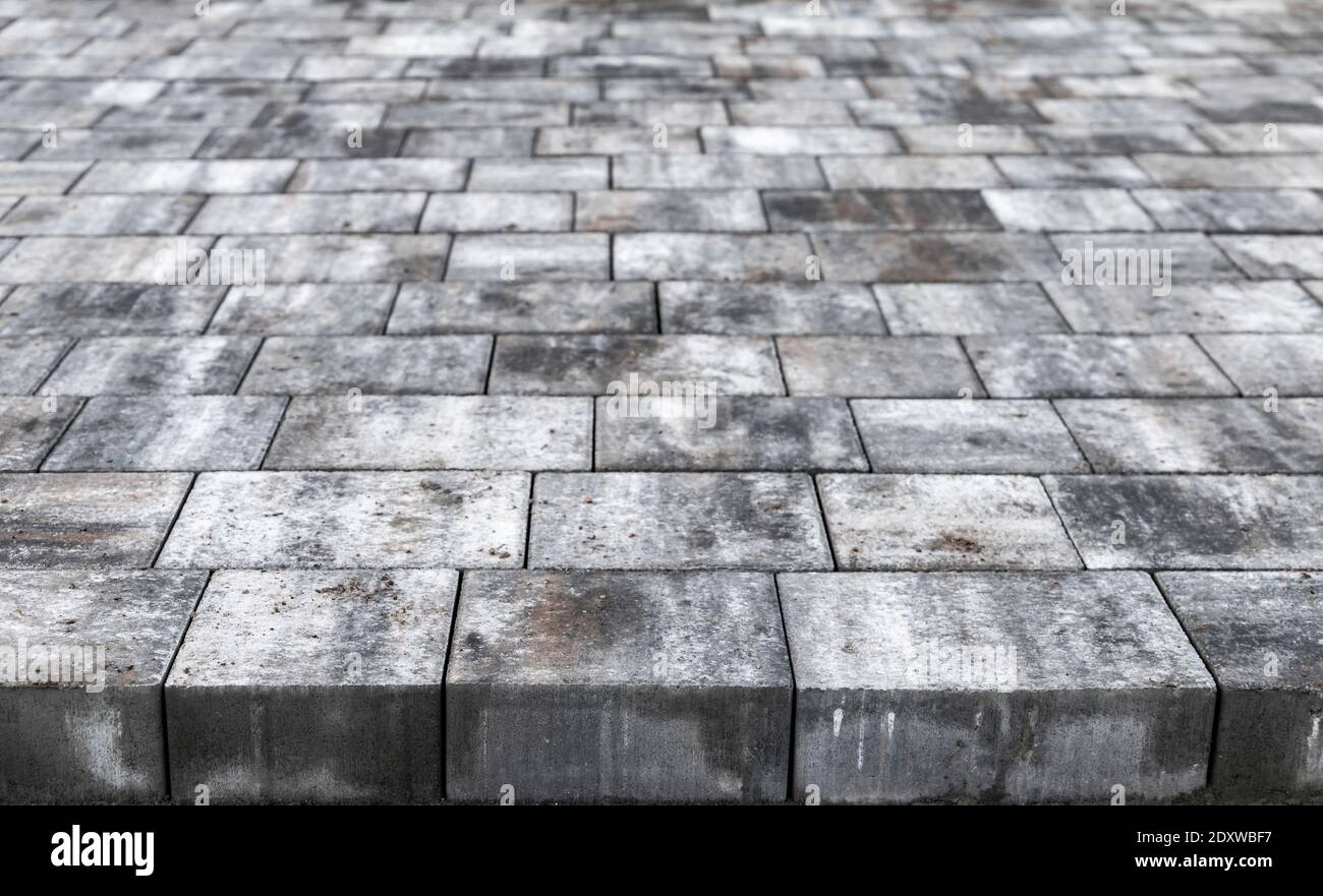Nuova foto di sfondo delle lastre di pavimentazione grigie con effetto prospettico e. messa a fuoco selettiva Foto Stock
