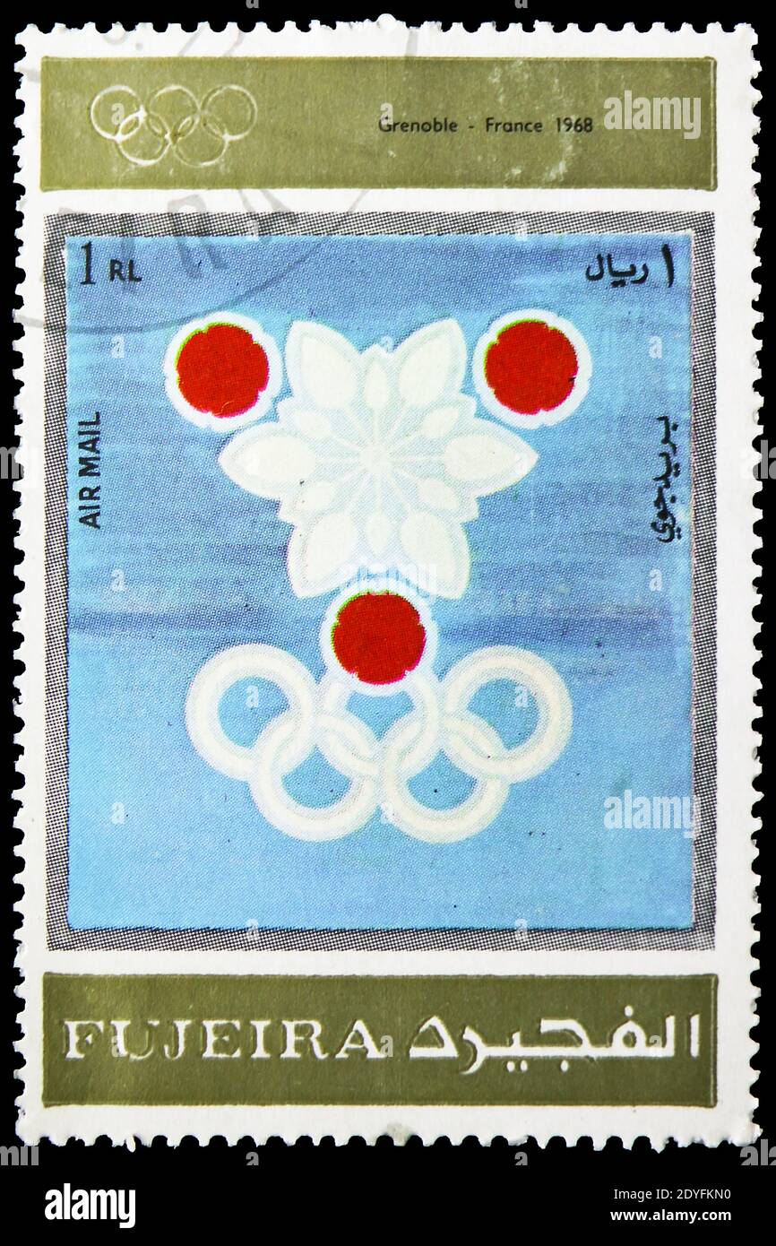 MOSCA, RUSSIA - 23 MARZO 2019: Francobollo stampato negli Emirati Arabi Uniti, Fujairah, spettacoli Grenoble 1968, Olimpiadi invernali 1924-1972, Pubblicità Foto Stock