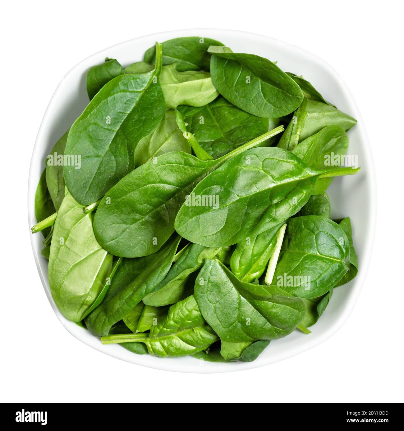 Foglie di insalata verde in una ciotola sul tavolo nero