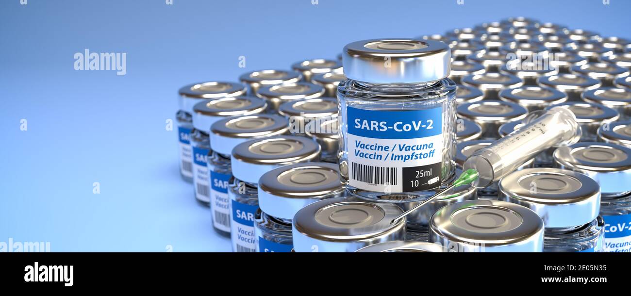 Concetto per la disponibilità di un vaccino sufficiente contro il nuovo virus della corona SARS-COV-2: Flaconi di vaccinazione e una siringa. La parola vaccinazione in inglese, Foto Stock