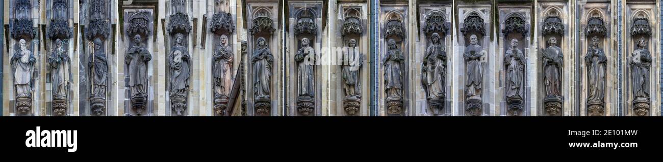 Sculture sacre e secolari sulla facciata della chiesa della Lambertikirche, Münster, Nord Reno-Westfalia, Germania, Europa Foto Stock