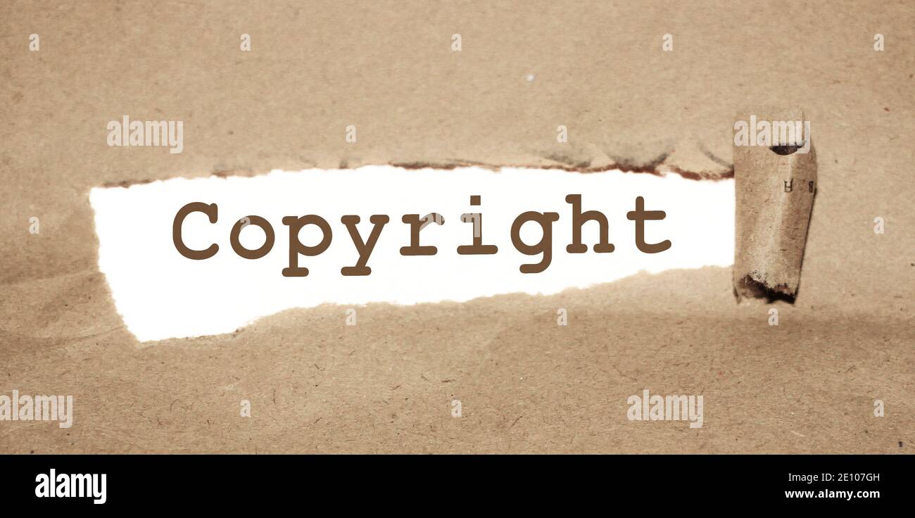 Carta strappata di uner di parola del copyright. Marcatura legale del marchio, concetto aziendale. Foto Stock