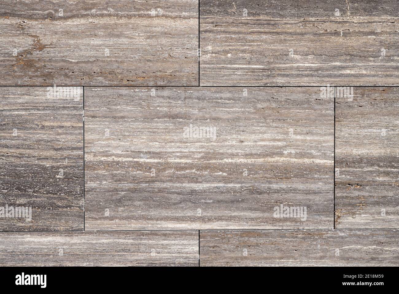 Sfondo da una parete di lastre di granito marrone Foto Stock