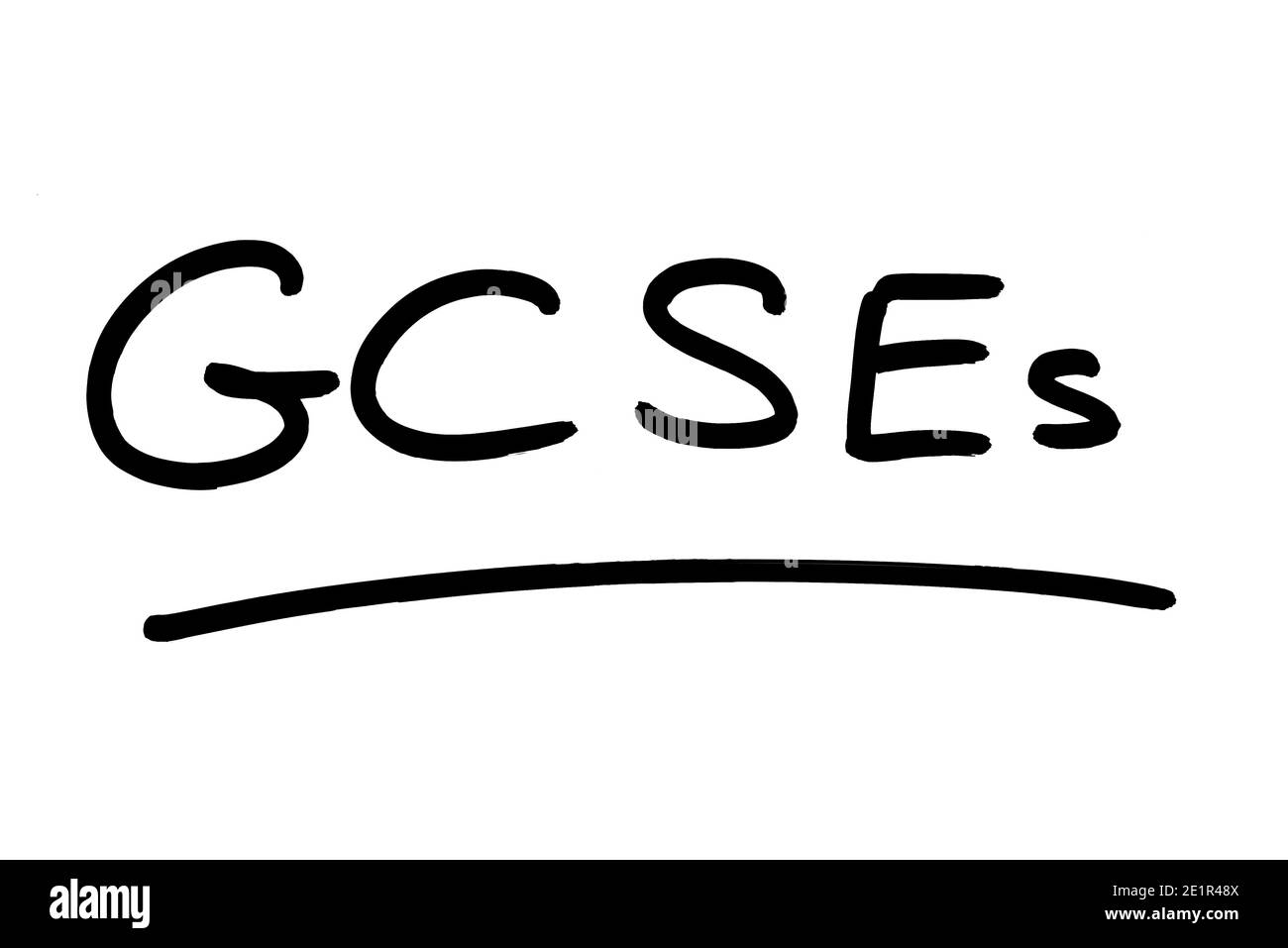 GCSE scritto a mano su sfondo bianco. Foto Stock