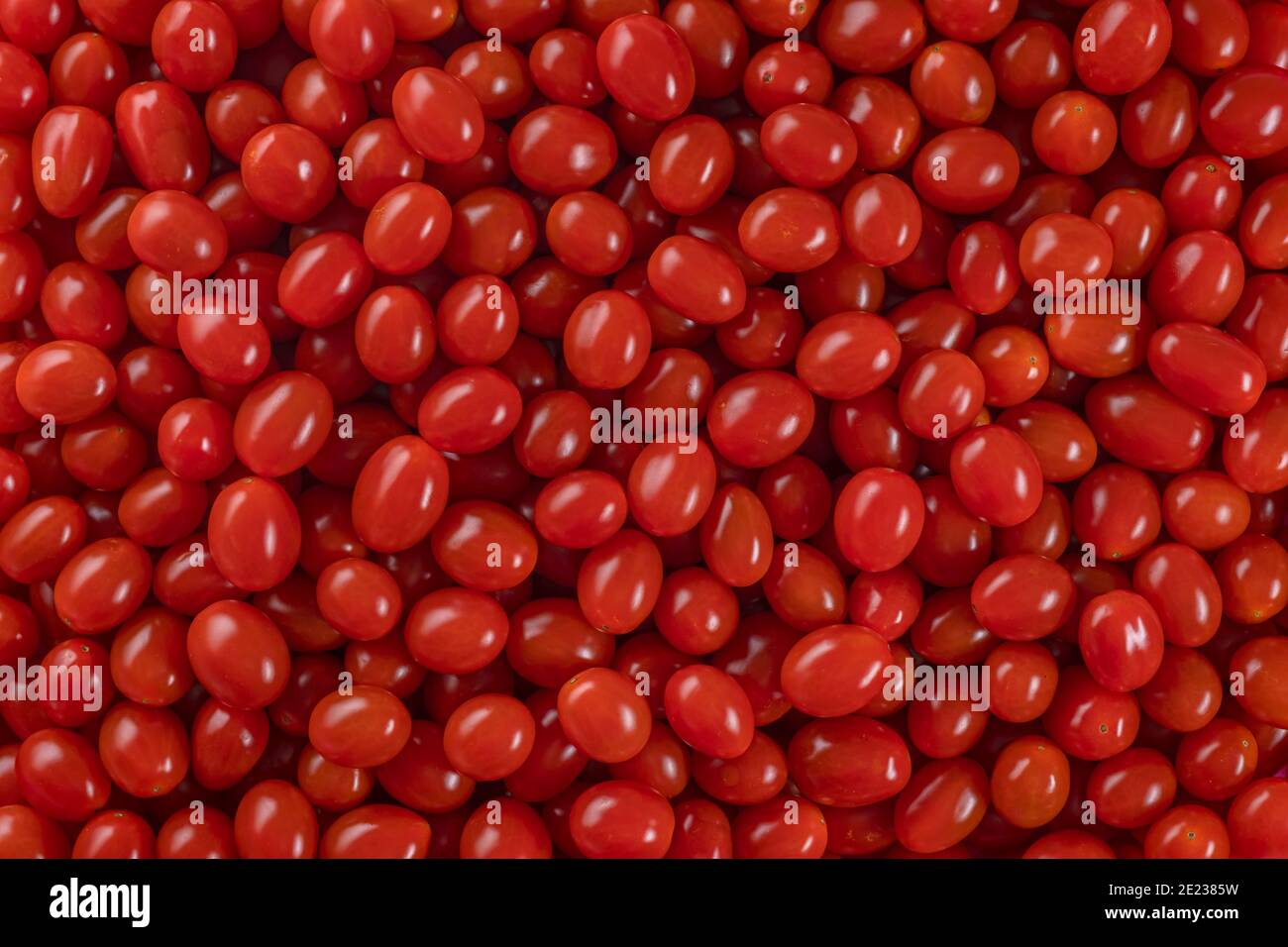 Fresco, pomodori ciliegia rosso fondo natura Foto Stock