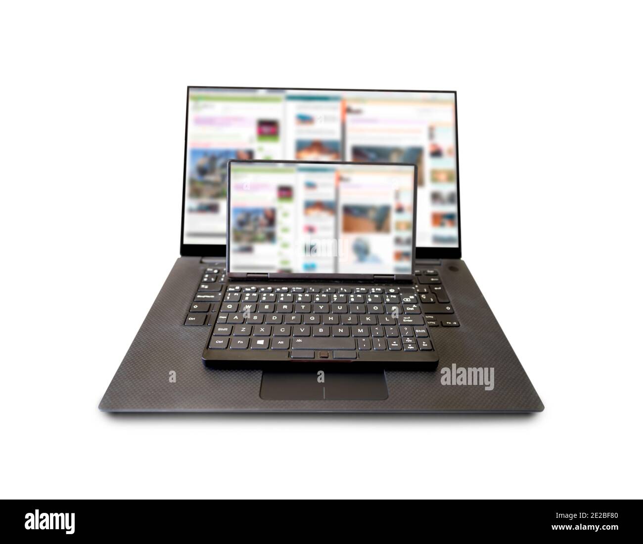 Computer portatile enorme e minuscolo con screenshot di colore bianco Foto Stock