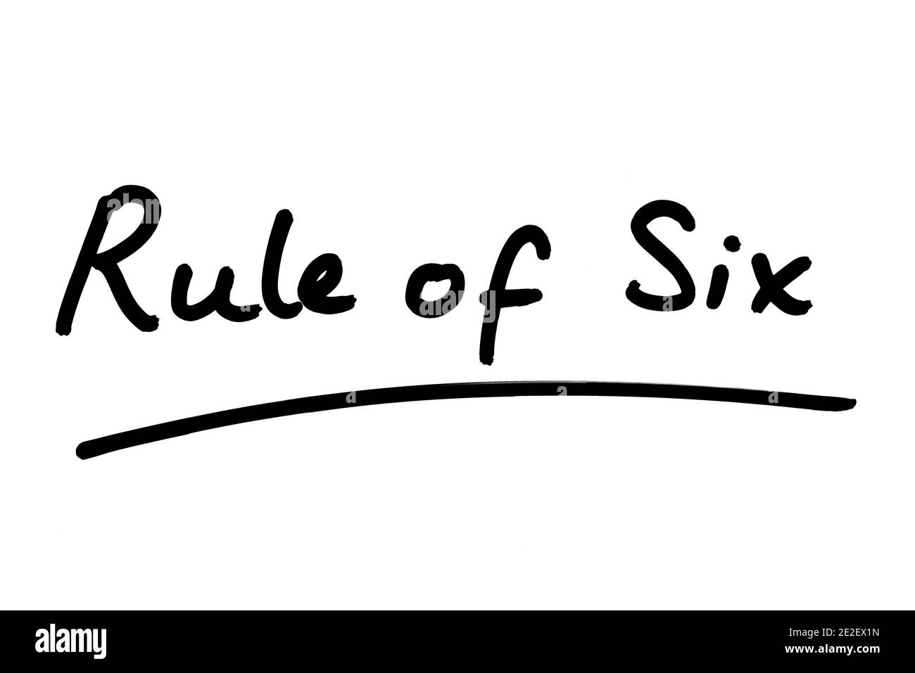 Regola di sei manoscritta su sfondo bianco. Foto Stock
