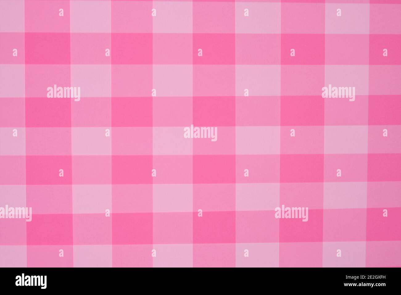 Motivo a scacchi geometrico in tonalità rosa. Sfondo di carta astratta in colori pastello. Foto Stock