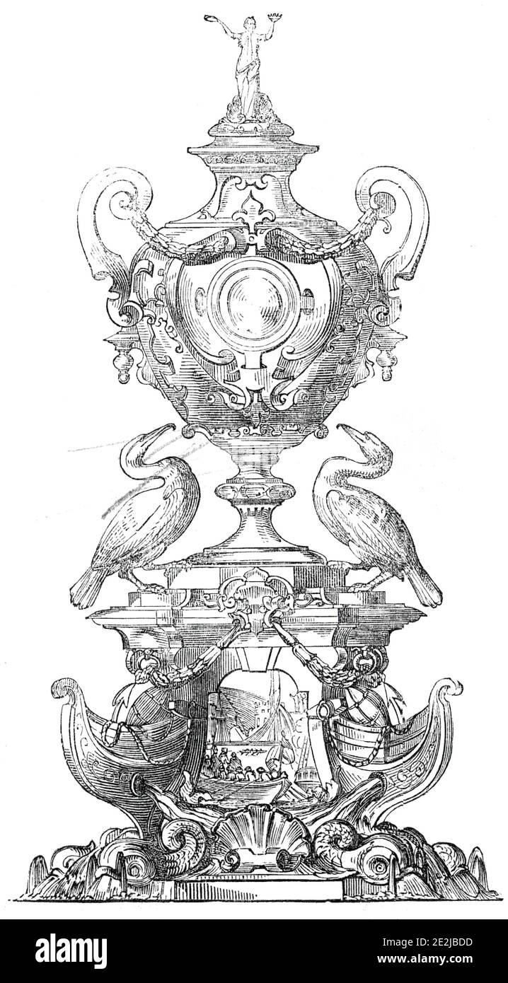 La Grand Challenge Cup, Royal Mersey Yacht Club, 1845. 'Questo pezzo di argento estremamente bello lavoro, in piedi quasi tre piedi di altezza, è stato eseguito da MR. Joseph Mayer, di Lord-Street, Liverpool. Si compone di una base triplicata, i cui angoli sono costituiti da delfini, e le pras di navi, con boe, ancore e altri emblemi nautici, sormontati da tre fegati...» Su una facciata, inseguito in bassorilievo, è '..."la regina Elisabetta che visita Sir Walter Raleigh, a Deptford, dopo il suo viaggio in America"...sulla base si trova un grande vaso da vino, le maniglie, con il loro pendano Foto Stock