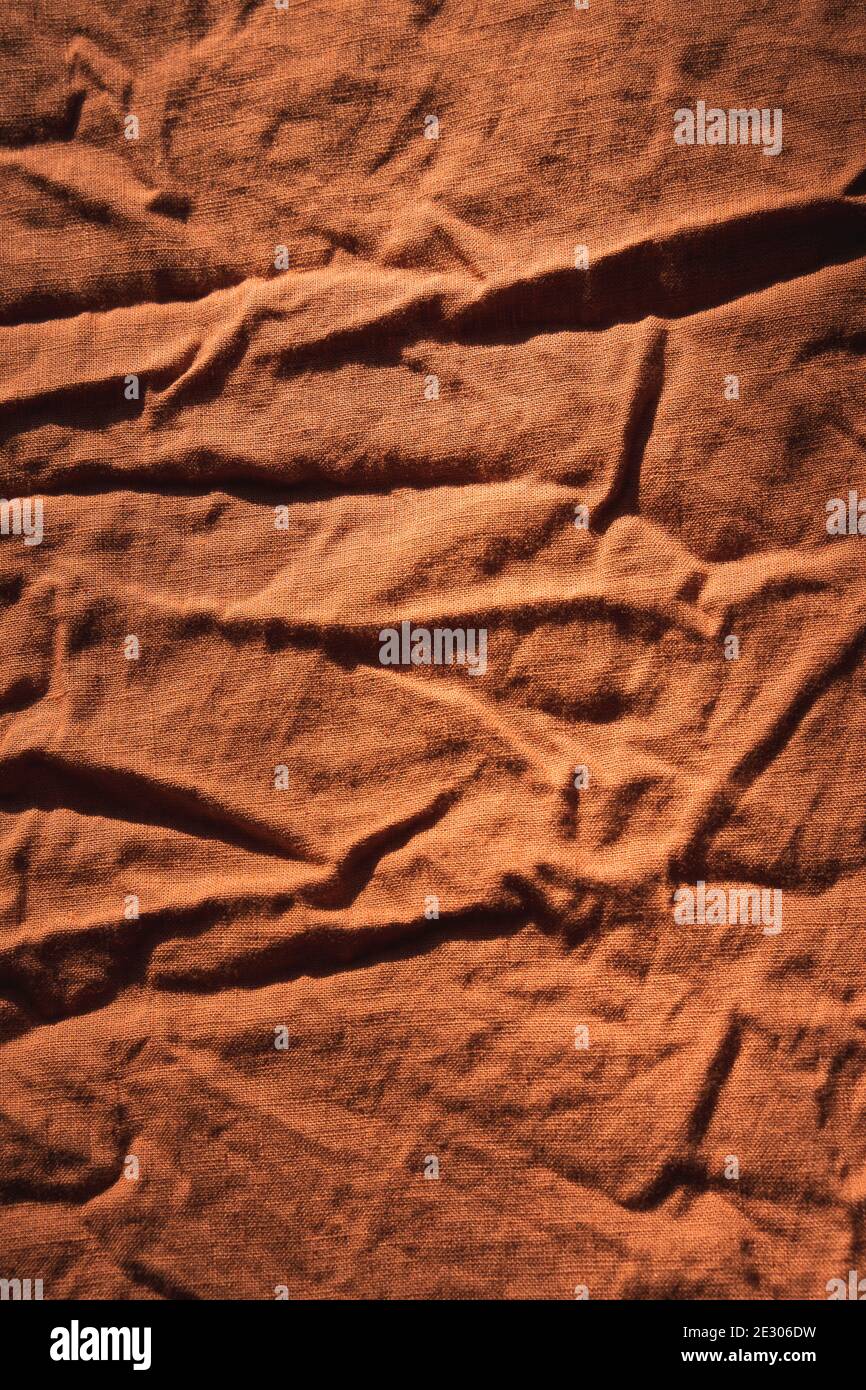 Trama della biancheria colorata con ruggine arancione bruciata. Foto Stock