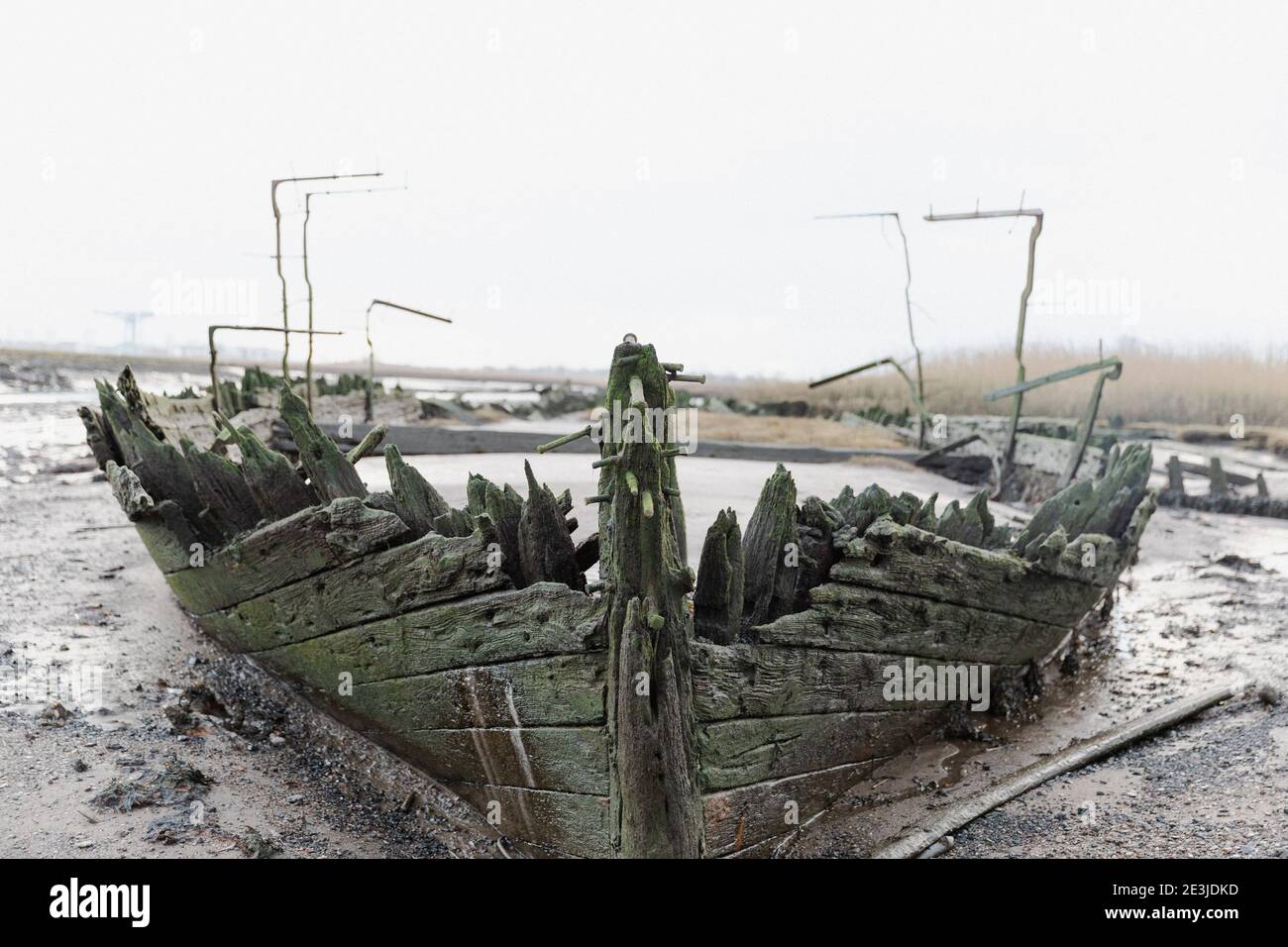 Nave Gravyard a Newshot Island, fiume Clyde alla periferia di Glasgow. Una selezione di navi Schooner e fanghi si posano sulle mudflats. Foto Stock