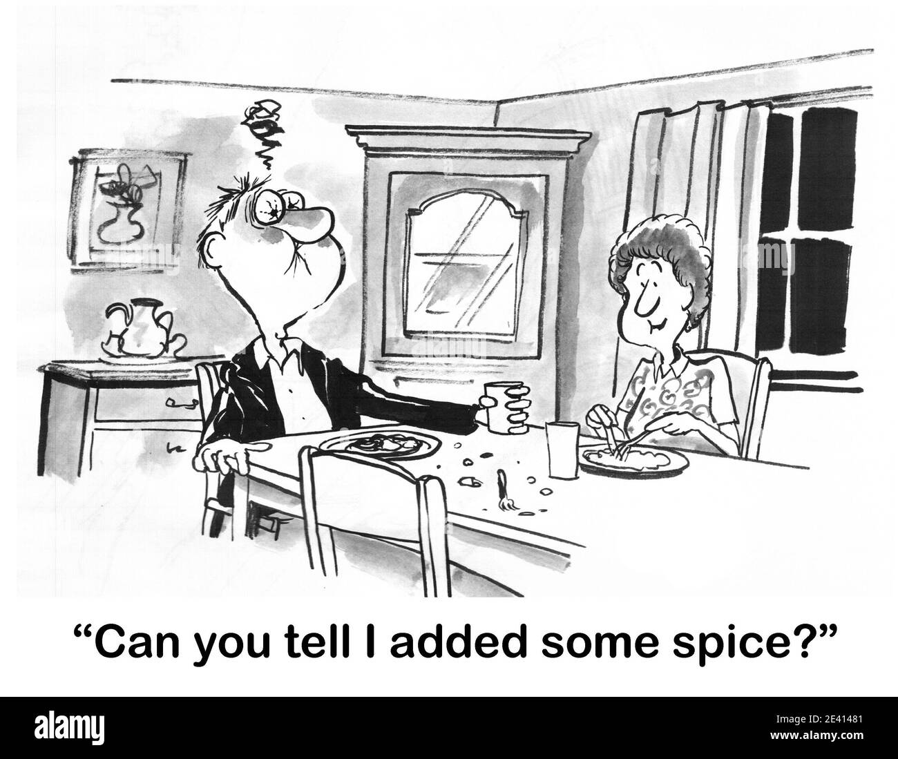 Il marito ha una reazione estrema al cibo piccante. Foto Stock