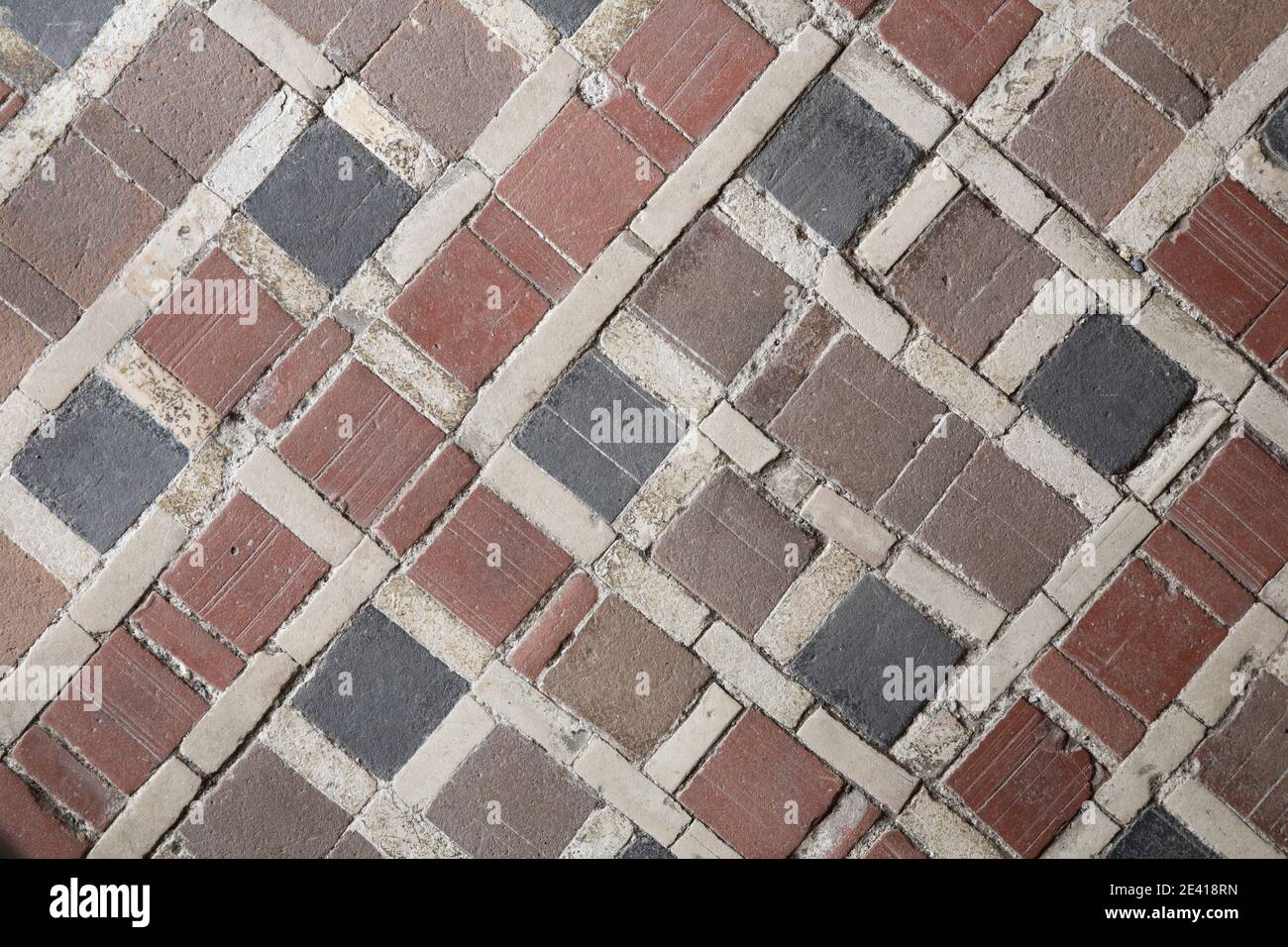 Fußboden mit alten Mosaiksteinen Foto Stock