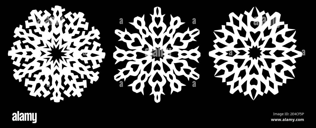 Fiocchi di neve diversi come carta tagliata in bianco e nero Foto Stock