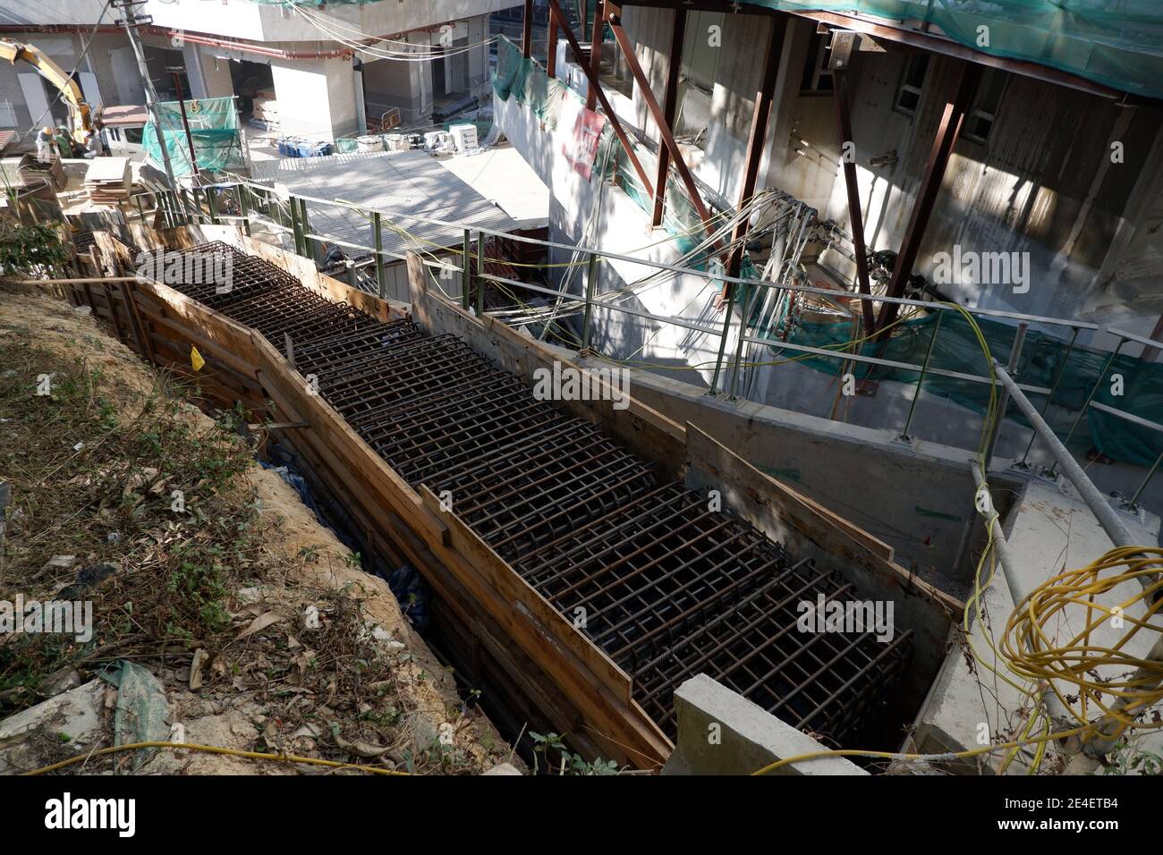 Scala di gabbia di armatura in un luogo di costruzione di alloggiamento pubblico A Hong Kong Foto Stock