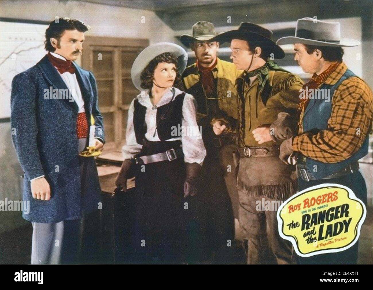 IL film RANGER E LA LADY 1940 con Henry Brandon a sinistra, Julie Bishop e Roy Rogers secondo da destra Foto Stock