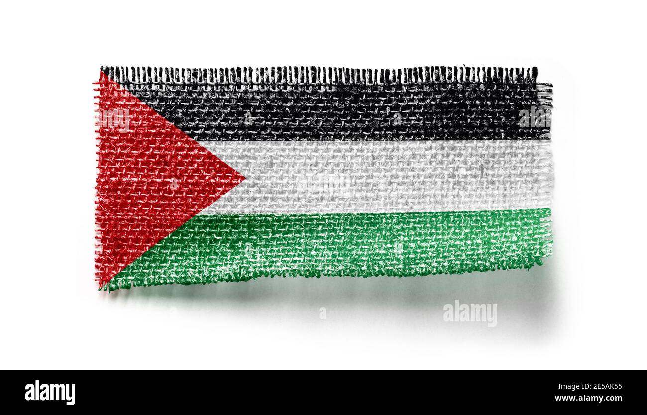 Bandiera palestinese su un pezzo di stoffa su un bianco sfondo Foto Stock