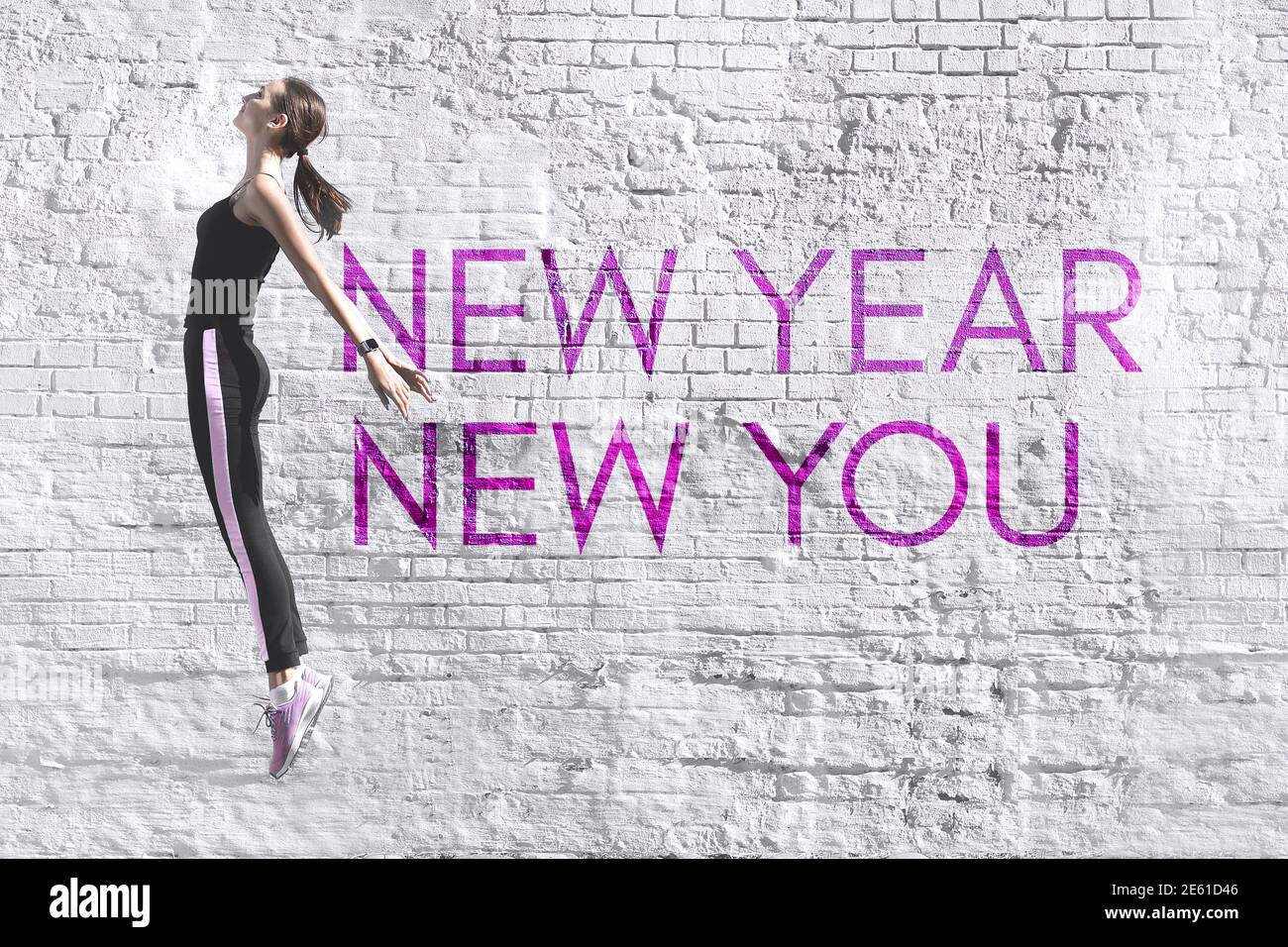 New Year New You - citazione motivazionale ispirata sotto forma di graffiti sullo sfondo di un vecchio muro di mattoni bianchi. Foto di alta qualità Foto Stock