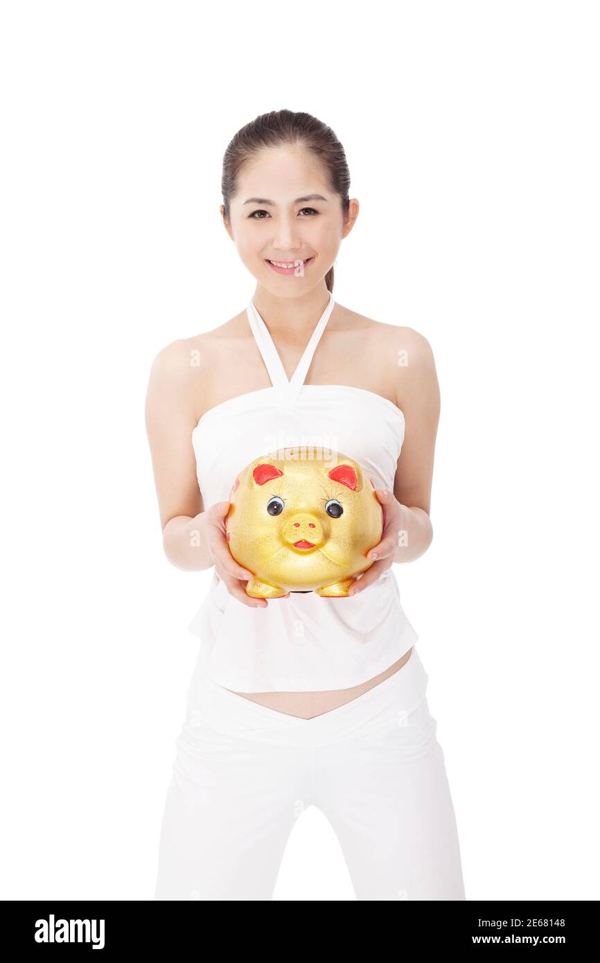 La giovane donna alla moda e porcellino banca foto di alta qualità Foto Stock