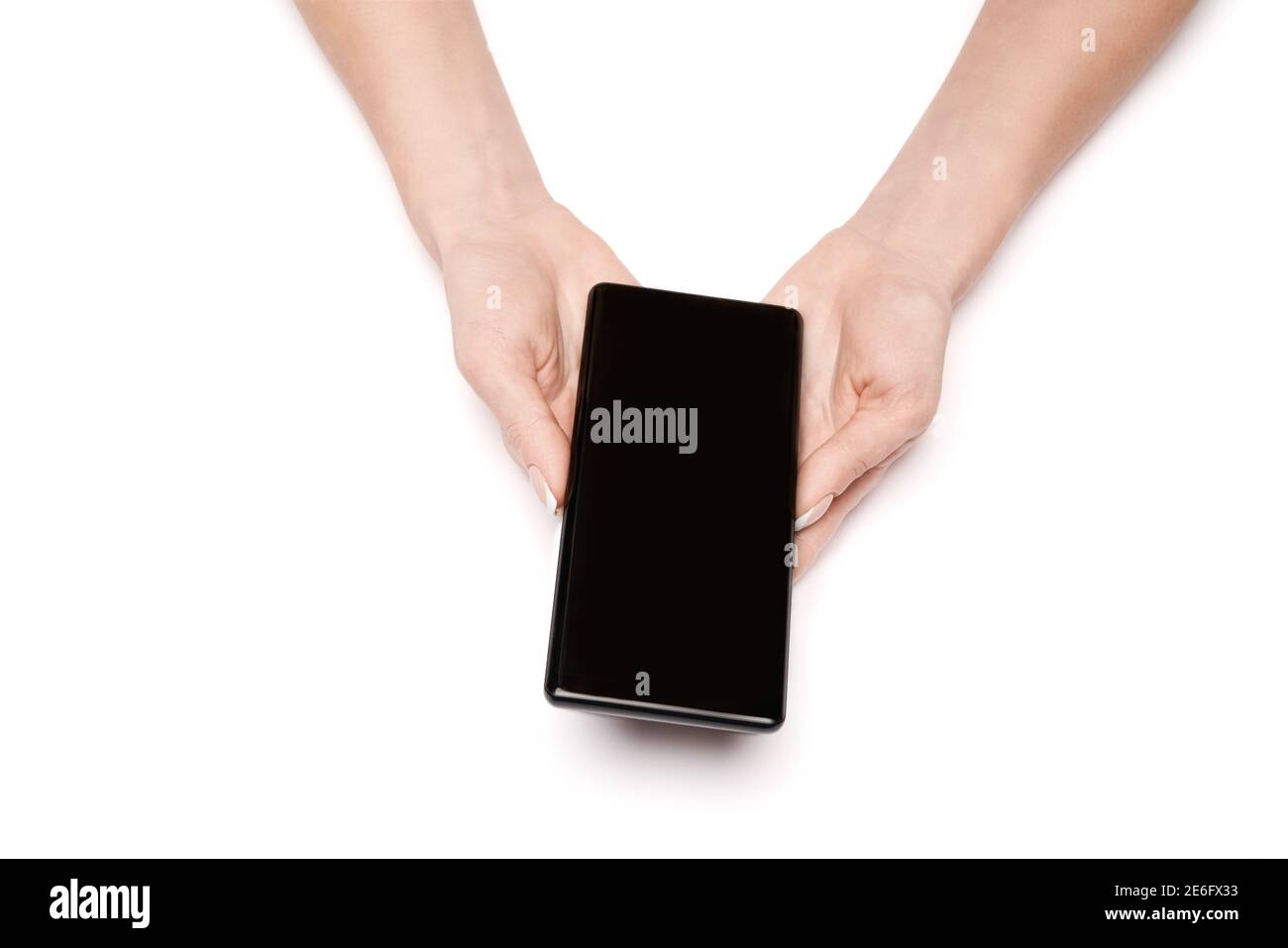 Vista dall'alto di una donna che tiene lo smartphone isolato su sfondo bianco Foto Stock
