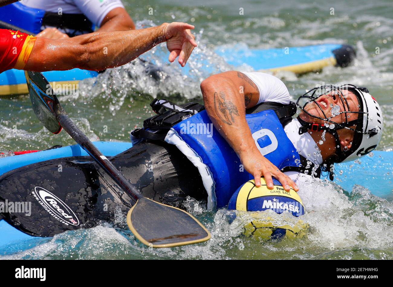 Italy's Bellini Luca fights for the ball against Spain during their men's canoe  polo qualifying match at the 2009 World Games in Kaohsiung July 17, 2009.  The World Games will be held