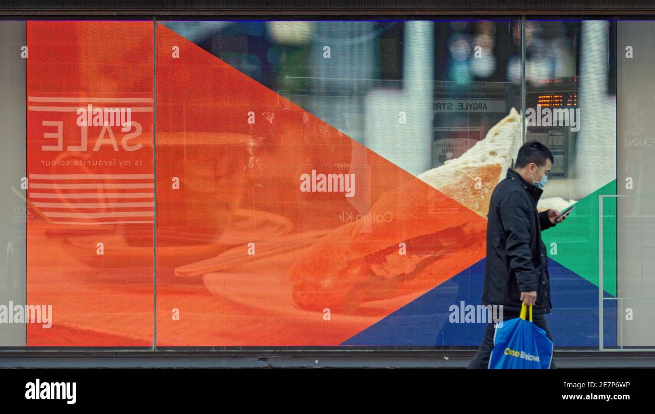 Glasgow, Scotland, UK.30th Gennaio, 2021, Lockdown Sabato ha visto la sincronicità o l'arte che rispecchia la vita. La miseria continua almeno la pioggia fermata come strade deserte nel centro città, le aree commerciali si affida in poster e wall art come un sostituto per la vita. Credit Gerard Ferry/Alamy Live News Foto Stock
