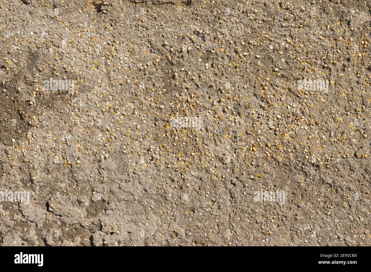 muro fatto di pietre e calcestruzzo come sfondo e carta da parati Foto Stock