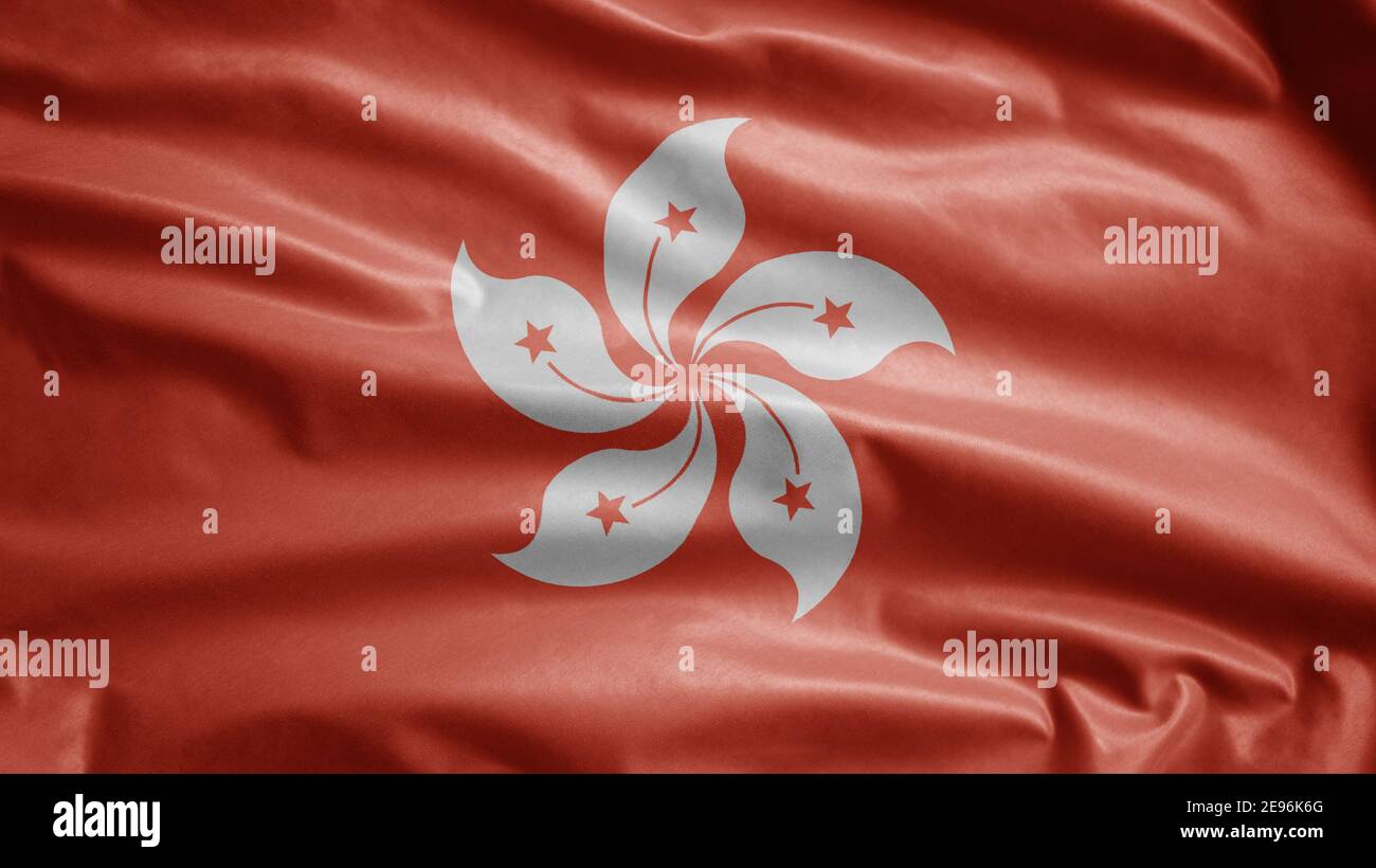 Bandiera di Hongkong sventolando nel vento. Primo piano di Hong Kong banner soffiante, seta morbida e liscia. Tessuto tessuto tessuto tessitura segno sfondo. Usalo per natia Foto Stock