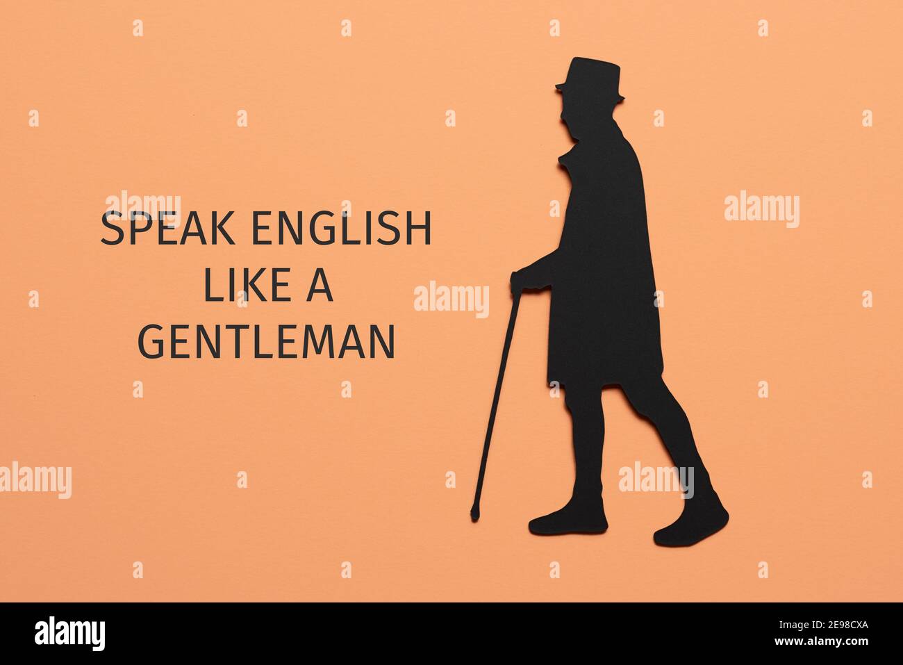il testo parla inglese come un signore e la silhouette di un uomo elegante, indossando cappello e utilizzando una canna da passeggio, ritagliato su un cartoncino nero, su un Foto Stock
