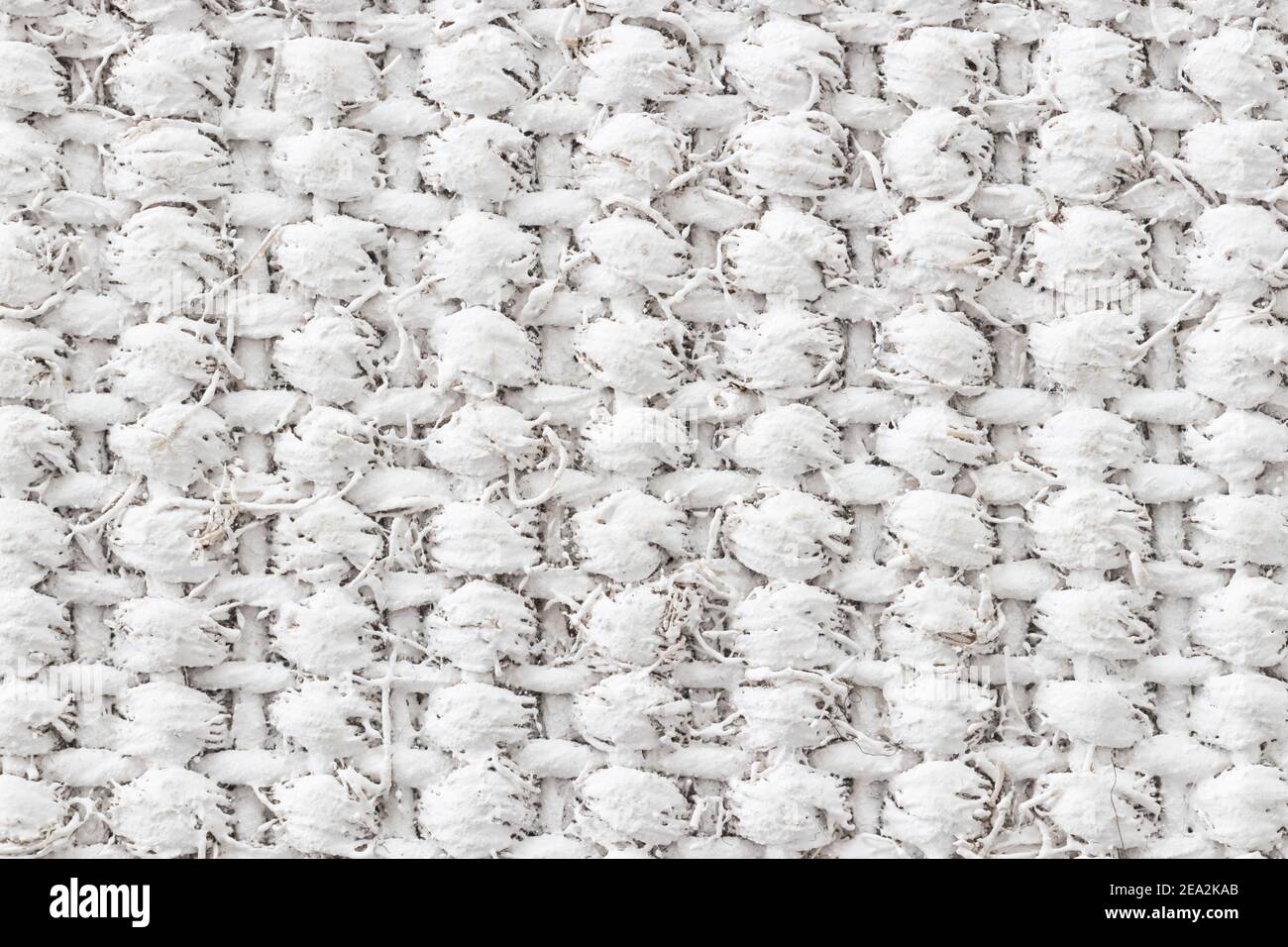 Disegno orizzontale e verticale di un tappeto di lamella intessuto verniciato bianco. Foto Stock