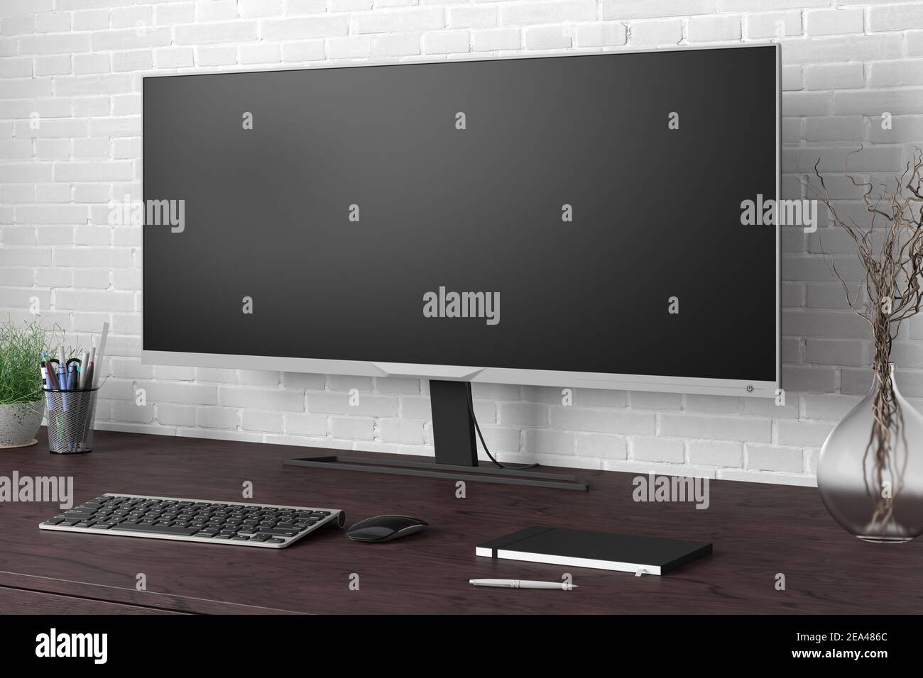 Modello display widescreen vuoto. Posto di lavoro con scrivania in legno scuro e parete in mattoni bianchi. Vista laterale Foto Stock